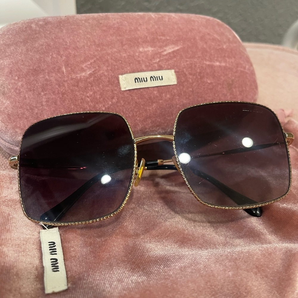 Miu Miu Women's Sunglasses with Gold Frame and Black Lenses